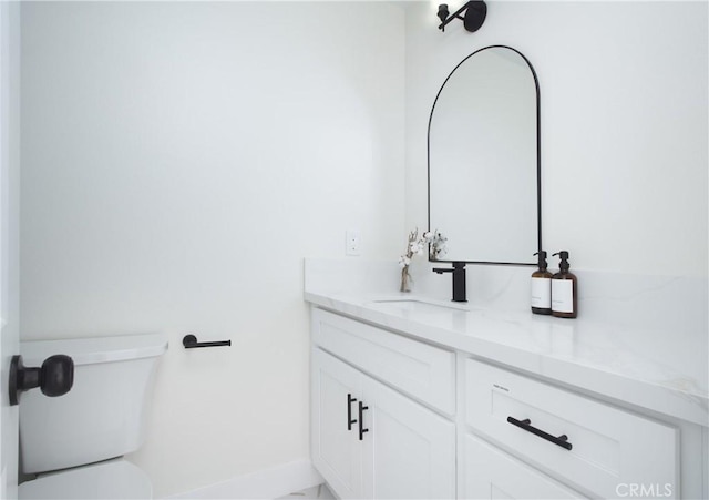 12842 Elizabeth Way, Tustin, CA 92780 - bathroom featuring vanity, toilet, and baseboards