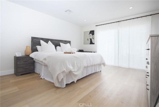 12842 Elizabeth Way, Tustin, CA 92780 - bedroom with light wood-style floors, recessed lighting, and baseboards