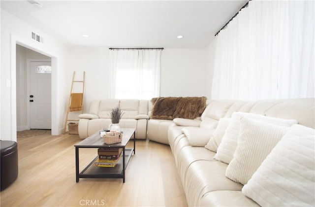12842 Elizabeth Way, Tustin, CA 92780 - living room featuring light wood finished floors, recessed lighting, and baseboards