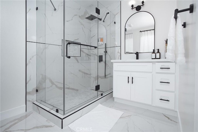12842 Elizabeth Way, Tustin, CA 92780 - full bathroom featuring marble finish floors, a marble finish shower, vanity, and baseboards
