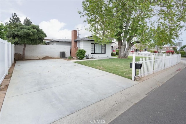 12842 Elizabeth Way, Tustin, CA 92780 - view of front of home with central AC unit and a chimney