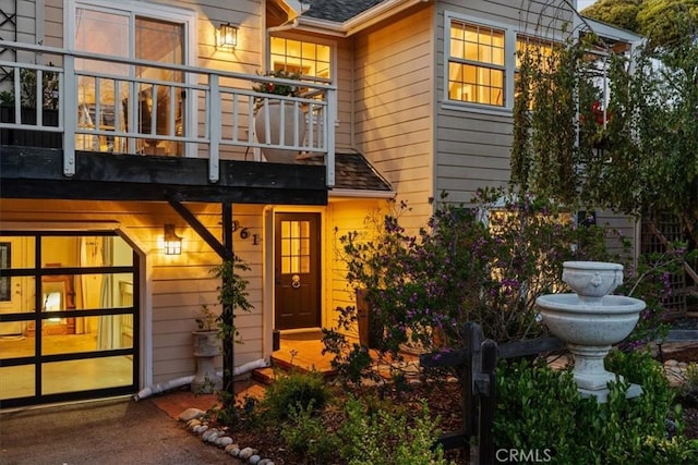 3061 Wood Dr, Cambria, CA 93428 - property entrance featuring a balcony and roof with shingles