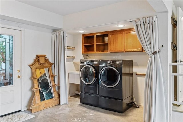 3061 Wood Dr, Cambria, CA 93428 - laundry room featuring washing machine and dryer and cabinet space