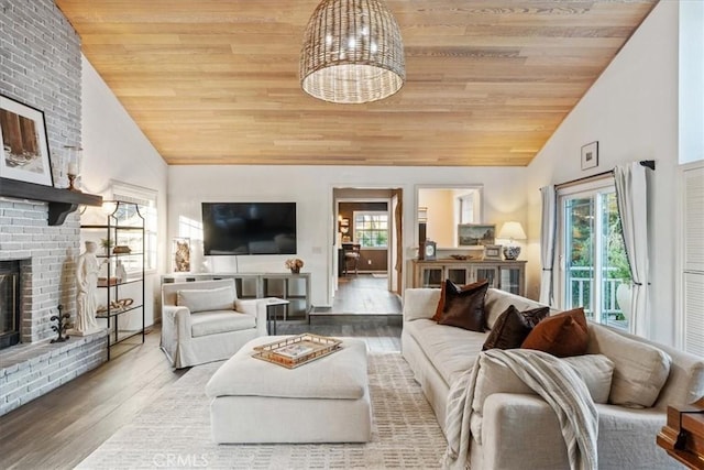 3061 Wood Dr, Cambria, CA 93428 - living room with wood ceiling, a fireplace, high vaulted ceiling, and wood finished floors
