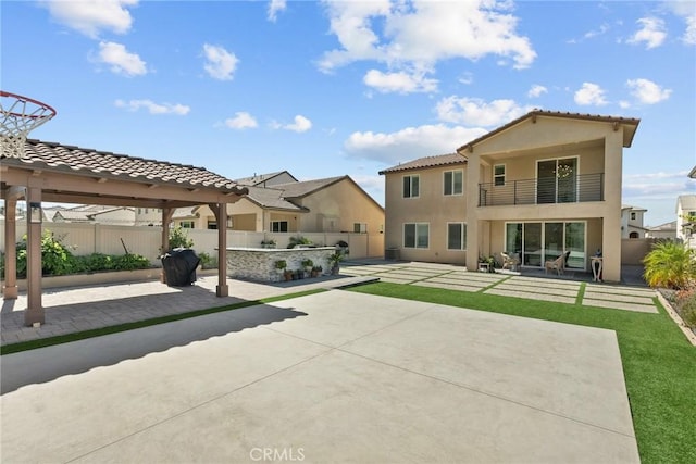 28600 Foothill Way, Saugus, CA 91350 - rear view of house featuring a balcony, stucco siding, and a patio area