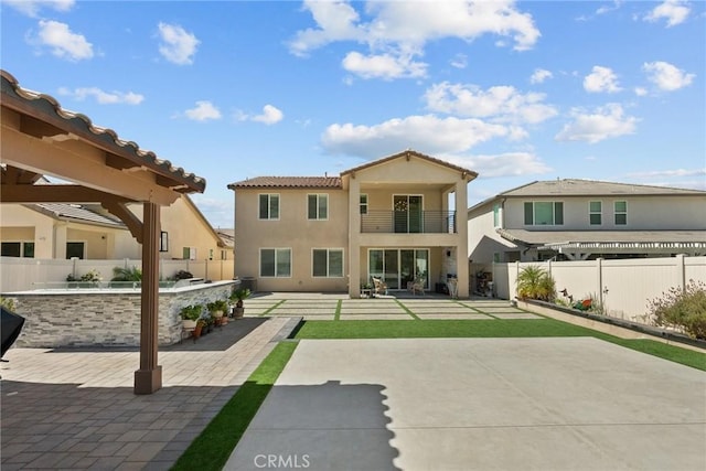 28600 Foothill Way, Saugus, CA 91350 - back of property featuring a balcony, a fenced backyard, a patio, stucco siding, and a tiled roof