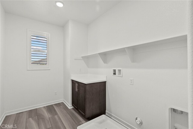 28600 Foothill Way, Saugus, CA 91350 - laundry room featuring dark wood-style flooring, washer hookup, and baseboards