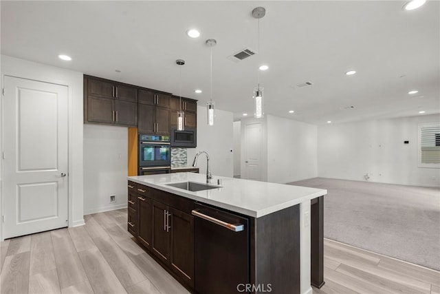 28600 Foothill Way, Saugus, CA 91350 - kitchen featuring a sink, dishwasher, black oven, stainless steel microwave, and dark brown cabinetry