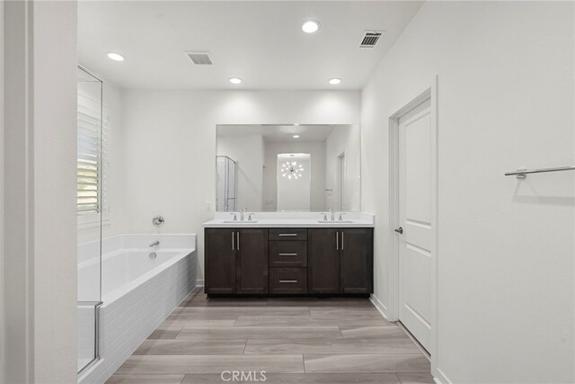 28600 Foothill Way, Saugus, CA 91350 - full bath with a bath, double vanity, a stall shower, recessed lighting, and a chandelier