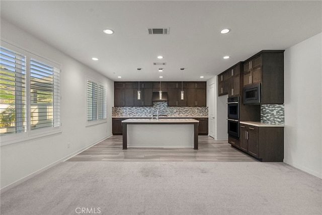28600 Foothill Way, Saugus, CA 91350 - kitchen with stainless steel microwave, decorative backsplash, dark brown cabinetry, and recessed lighting