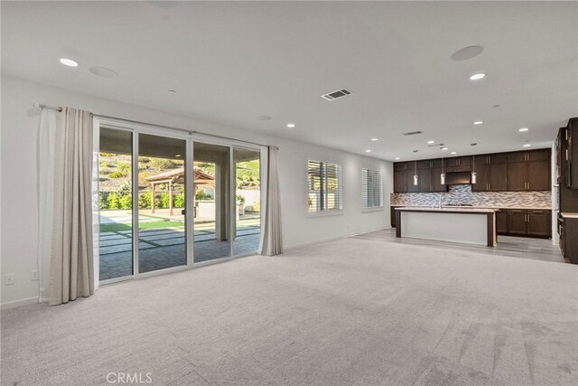 28600 Foothill Way, Saugus, CA 91350 - unfurnished living room with light colored carpet, recessed lighting, and baseboards