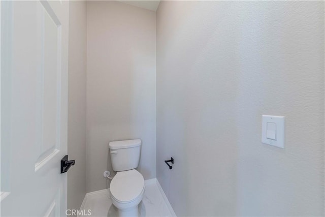 1705 Almond Tree Pl, Upland, CA 91784 - bathroom with baseboards and toilet