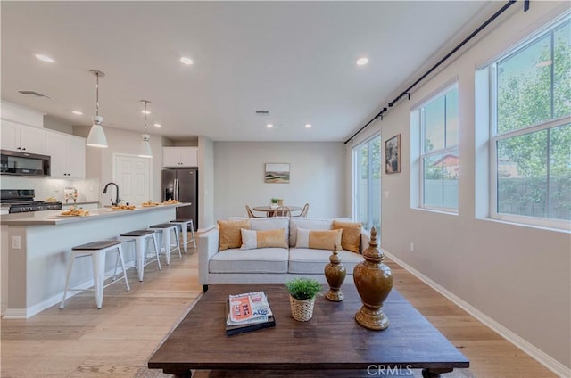 1705 Almond Tree Pl, Upland, CA 91784 - living room featuring recessed lighting, light wood-style flooring, and baseboards