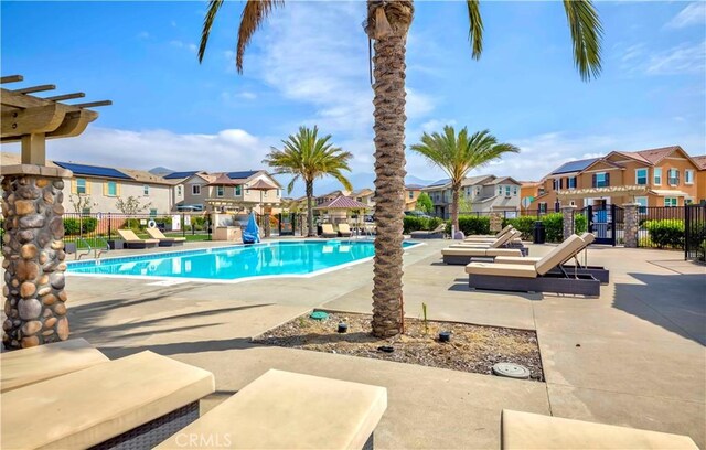 1705 Almond Tree Pl, Upland, CA 91784 - community pool featuring a residential view, fence, and a patio