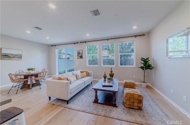 1705 Almond Tree Pl, Upland, CA 91784 - living area featuring healthy amount of natural light, light wood-style floors, recessed lighting, and baseboards