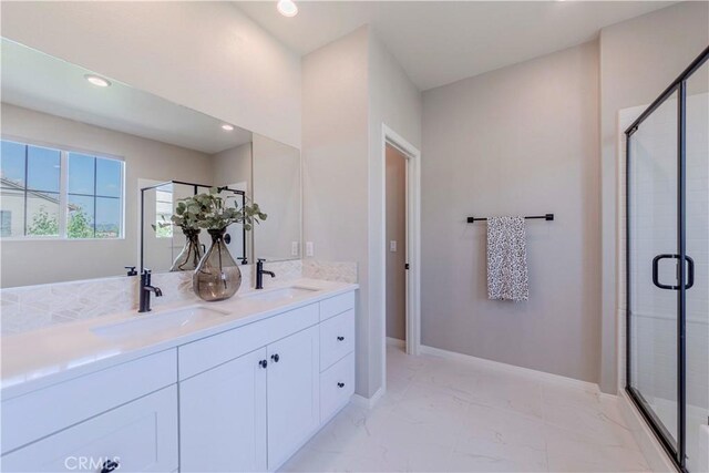 1705 Almond Tree Pl, Upland, CA 91784 - bathroom featuring a stall shower, recessed lighting, double vanity, baseboards, and marble finish floors