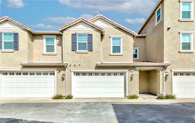1705 Almond Tree Pl, Upland, CA 91784 - multi unit property with stucco siding, a garage, and a tile roof