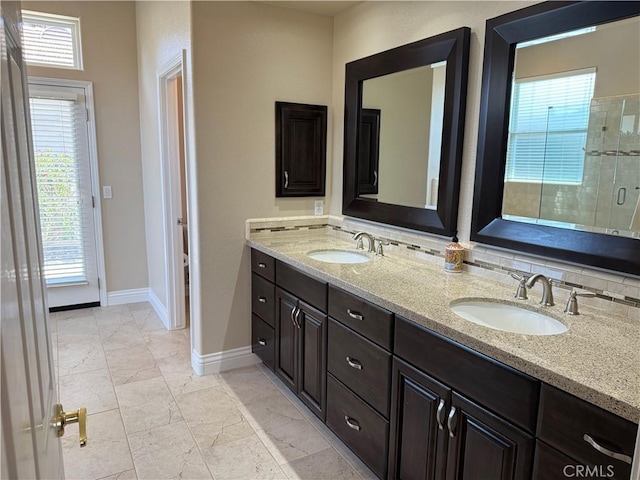 1145 Oakmont Pl, Nipomo, CA 93444 - bathroom with marble finish flooring, baseboards, a stall shower, and double vanity