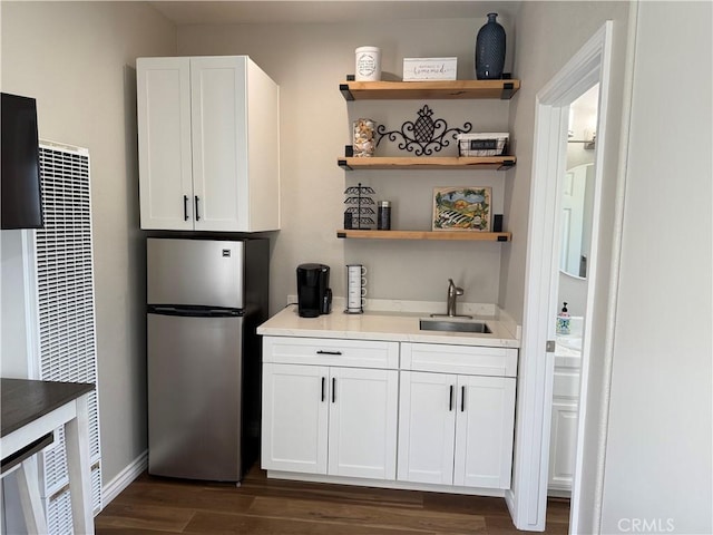 1145 Oakmont Pl, Nipomo, CA 93444 - kitchen featuring freestanding refrigerator, a sink, a heating unit, dark wood finished floors, and white cabinets
