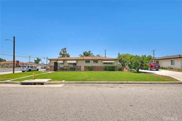 18021 E Cypress St, Covina, CA 91722 - view of front of house with a front yard, driveway, and brick siding
