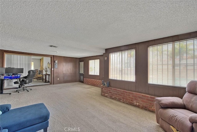 18021 E Cypress St, Covina, CA 91722 - carpeted living room with a textured ceiling and wooden walls