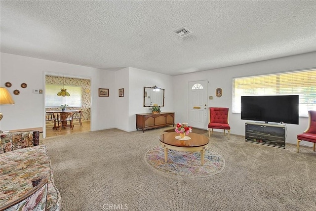 18021 E Cypress St, Covina, CA 91722 - living room featuring carpet floors and a textured ceiling