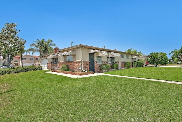 18021 E Cypress St, Covina, CA 91722 - view of front of property with an attached garage, a front yard, and brick siding