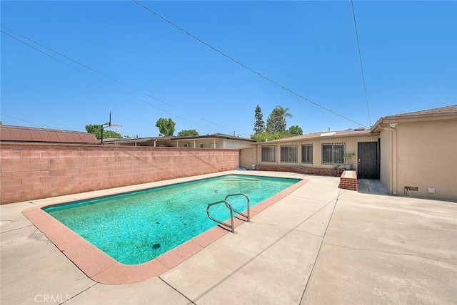 18021 E Cypress St, Covina, CA 91722 - view of swimming pool featuring a patio and a fenced backyard