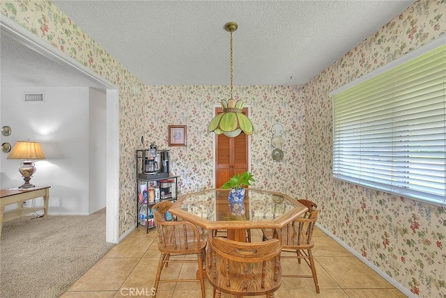 18021 E Cypress St, Covina, CA 91722 - dining room featuring a textured ceiling, wallpapered walls, tile patterned flooring, and baseboards