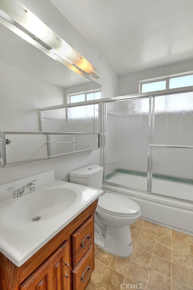 18021 E Cypress St, Covina, CA 91722 - full bathroom with vanity, bath / shower combo with glass door, and toilet