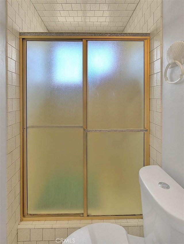 18021 E Cypress St, Covina, CA 91722 - bathroom with toilet, a shower with door, and tile patterned floors