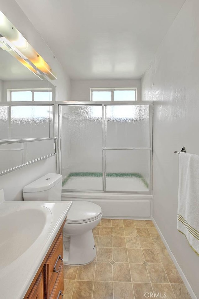 18021 E Cypress St, Covina, CA 91722 - full bathroom with vanity, healthy amount of natural light, toilet, and enclosed tub / shower combo
