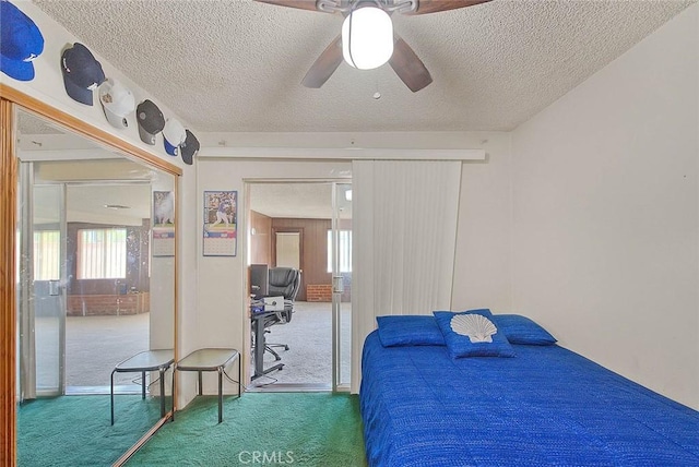 18021 E Cypress St, Covina, CA 91722 - bedroom featuring carpet flooring, multiple windows, a textured ceiling, a ceiling fan, and a closet