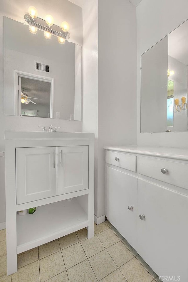 18021 E Cypress St, Covina, CA 91722 - bathroom featuring vanity, baseboards, and a ceiling fan