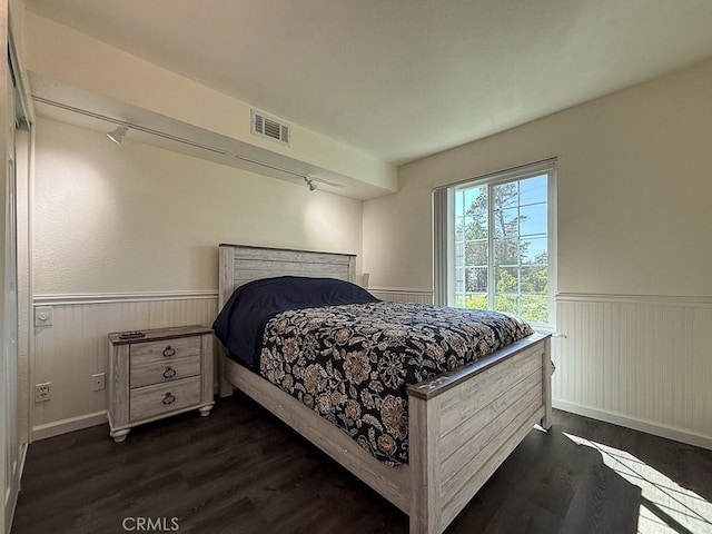 540 Pico Ave Unit 110, San Simeon, CA 93452 - bedroom featuring a wainscoted wall and dark wood finished floors