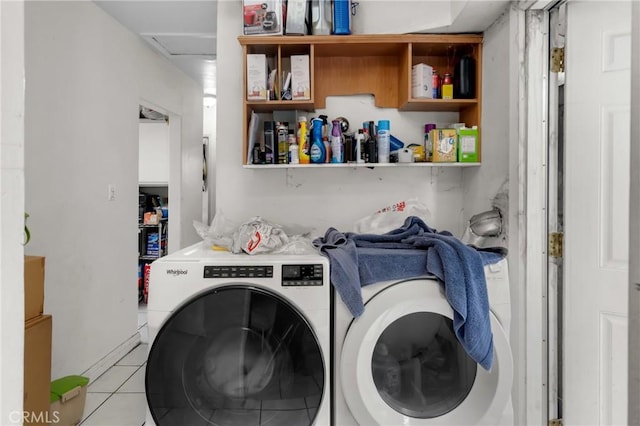 laundry area with independent washer and dryer, light tile patterned flooring, and attic access
