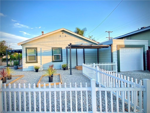 945 N Dickel St, Anaheim, CA 92805 - view of front of property with a garage and a fenced front yard