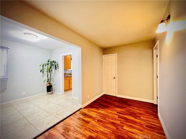 945 N Dickel St, Anaheim, CA 92805 - empty room with light wood-style flooring and baseboards