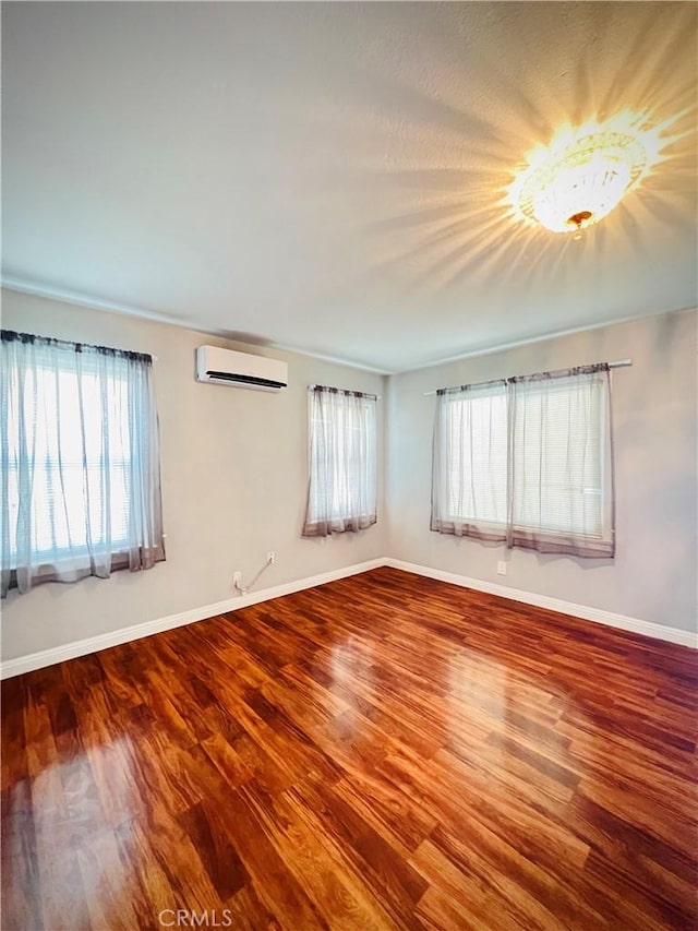 945 N Dickel St, Anaheim, CA 92805 - spare room featuring healthy amount of natural light, wood finished floors, and baseboards