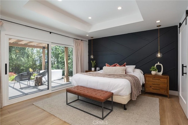 2315 Heather Ln, Newport Beach, CA 92660 - bedroom with access to exterior, light wood-style flooring, a tray ceiling, recessed lighting, and a decorative wall