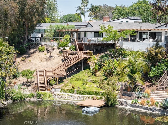 2315 Heather Ln, Newport Beach, CA 92660 - back of house with stairs and a chimney