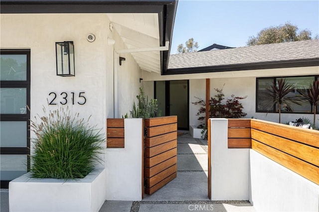 2315 Heather Ln, Newport Beach, CA 92660 - property entrance featuring roof with shingles and stucco siding