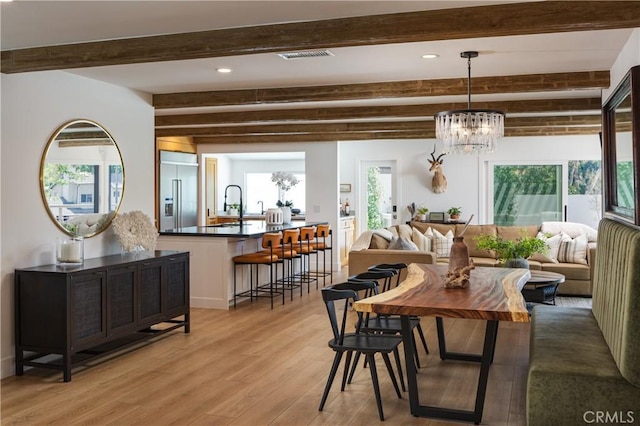 2315 Heather Ln, Newport Beach, CA 92660 - dining area with beamed ceiling, light wood finished floors, a chandelier, and recessed lighting
