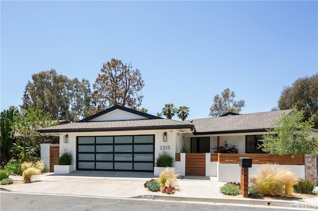 2315 Heather Ln, Newport Beach, CA 92660 - view of front of home with an attached garage, driveway, stucco siding, and roof with shingles