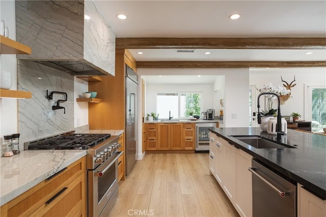 2315 Heather Ln, Newport Beach, CA 92660 - kitchen with premium appliances, a sink, beverage cooler, light stone countertops, and recessed lighting