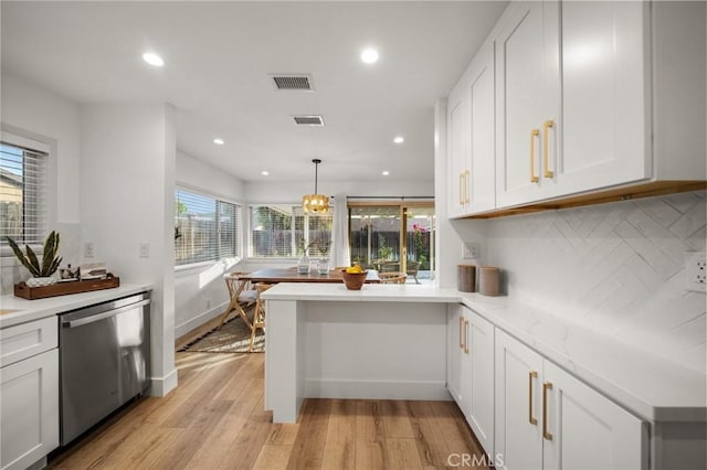 2812 Loyola St, Riverside, CA 92503 - kitchen featuring dishwasher, light countertops, light wood-style floors, backsplash, and white cabinets