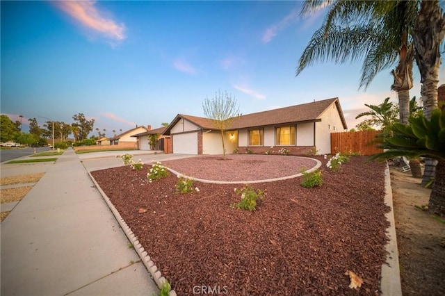 2812 Loyola St, Riverside, CA 92503 - single story home with an attached garage, fence, concrete driveway, and stucco siding