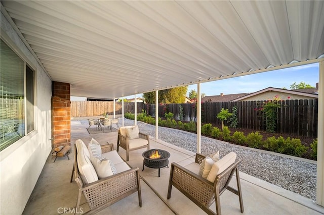 2812 Loyola St, Riverside, CA 92503 - view of patio with a fenced backyard, outdoor dining area, and an outdoor living space with a fire pit