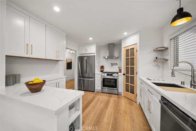 2812 Loyola St, Riverside, CA 92503 - kitchen featuring appliances with stainless steel finishes, wall chimney range hood, open shelves, a sink, and recessed lighting