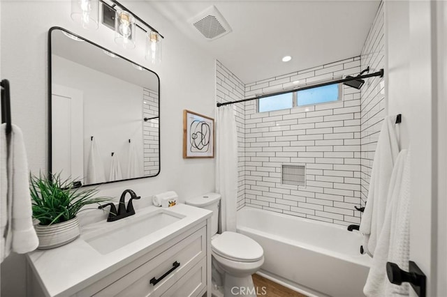 2812 Loyola St, Riverside, CA 92503 - full bath with toilet, shower / tub combo with curtain, vanity, and wood finished floors